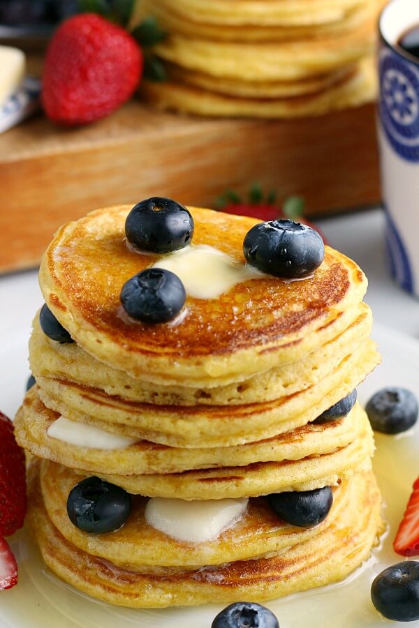 Stack of hotcakes with blueberries and syrup