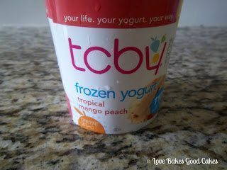 Soft Tropical Mango Peach frozen yogurt in carton