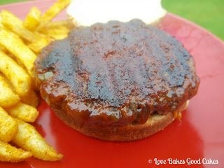 BBQ Bacon Jalapeno Cheddar Stuffed Burger with french fries on red plate