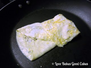 Egg McFake Muffin Sandwich folding egg in pan.