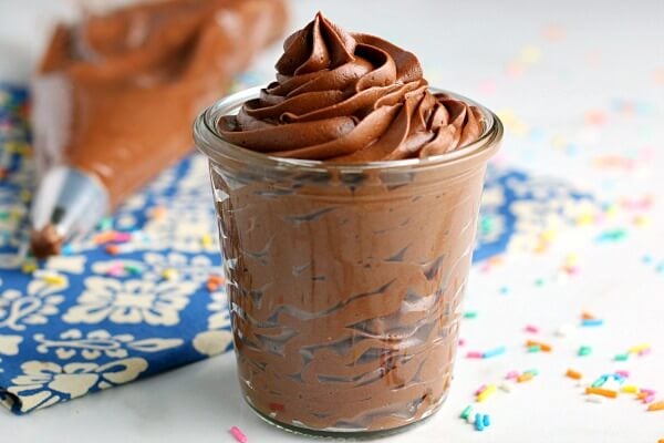 chocolate frosting with cocoa powder in glass jar