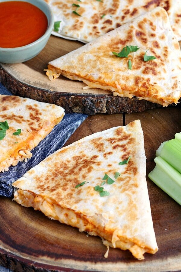 This image shows the finished buffalo chicken quesadillas cut and ready to be served. 