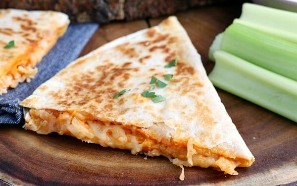 closeup of Buffalo Chicken Quesadilla cut into wedges and ready to be served