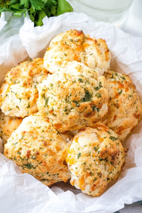 overhead shot of cheddar bay biscuits in bowl