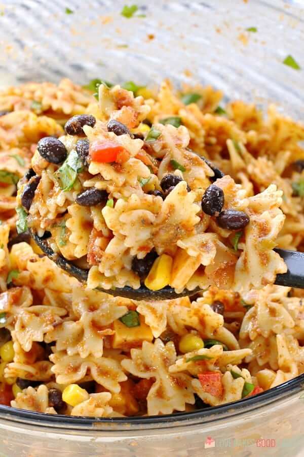 Taco Pasta Salad in bowl close up on spoon.
