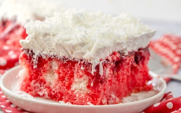 Raspberry Poke Cake closeup view of the jello seeping into the cake