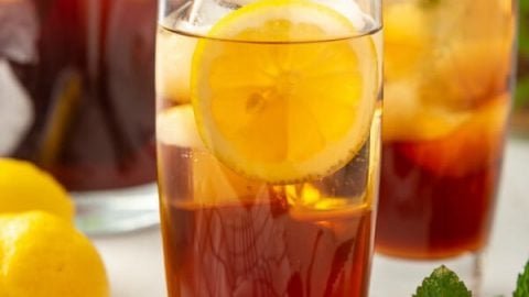 Iced Tea In Plastic Cup With Lemon And Mint Stock Photo, Picture