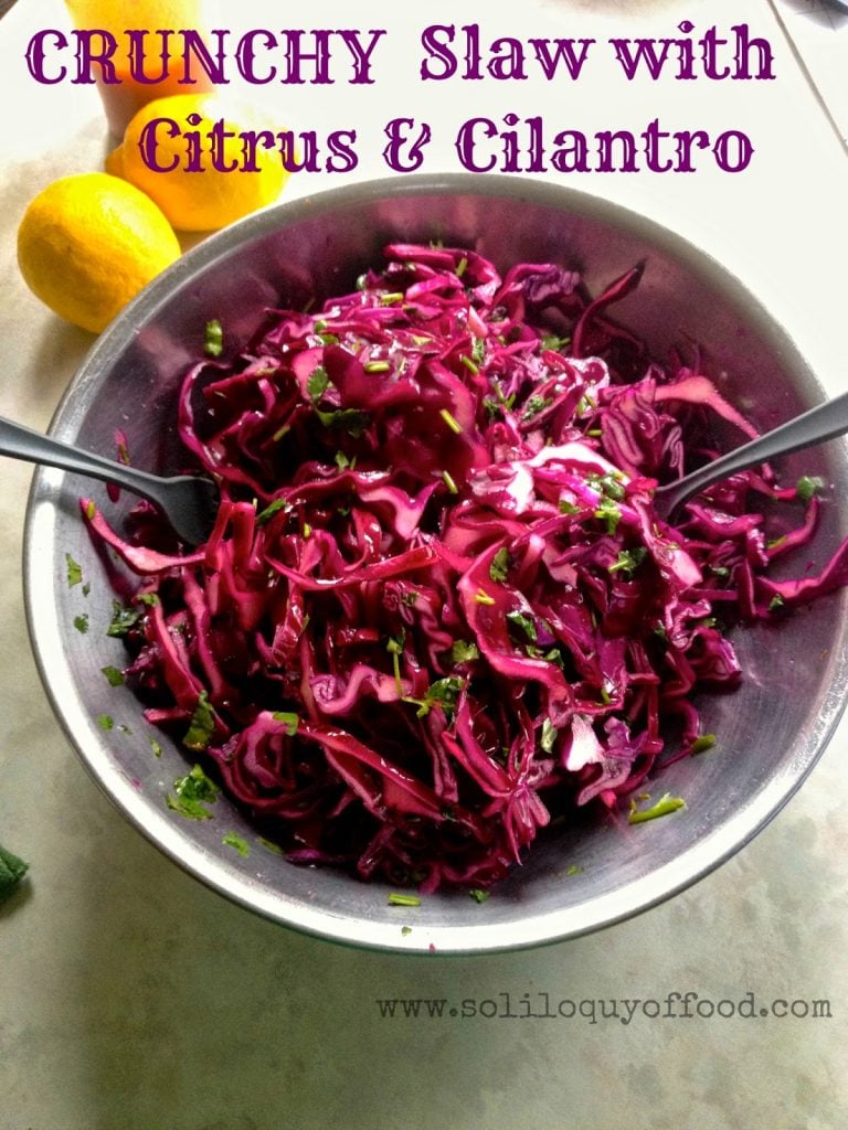 Crunchy Slaw with Citrus & Cilantro in a metal mixing bowl.