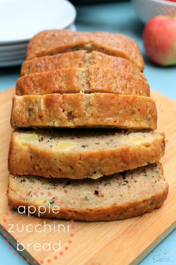 Apple Zucchini Bread slices stacked up on cutting board.