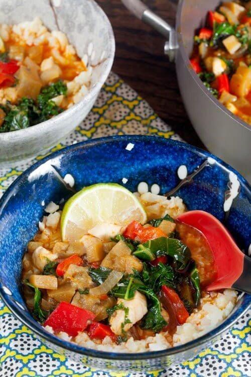 Red Curry Eggplant and Kale Over Cauliflower “Rice” in a bowl.