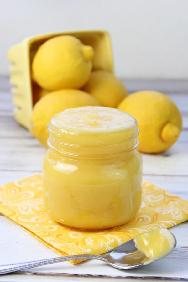 lemon curd in glass with spoon