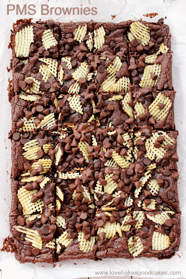 PMS Brownies with Cape Cod® Potato Chips on parchment paper.