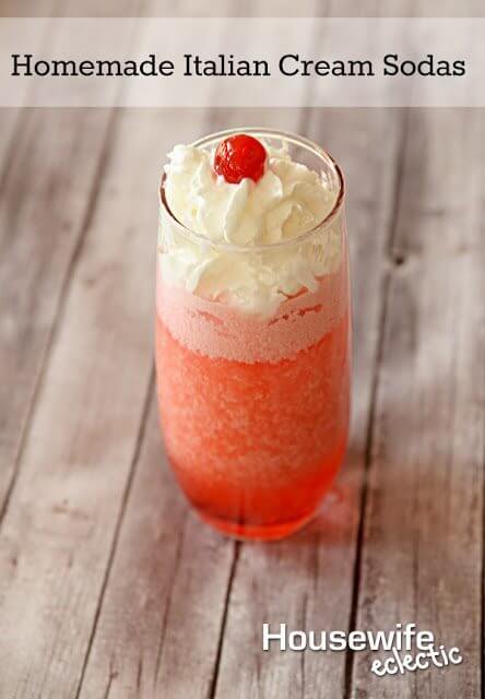 Homemade Italian Cream Sodas in a glass with a cherry on top.