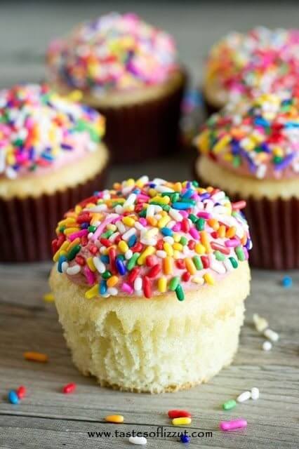 White Cream Cupcakes with rainbow sprinkles.