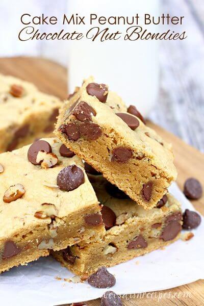 Cake Mix Peanut Butter Chocolate Nut Blondies stacked on a plate with chocolate chips.