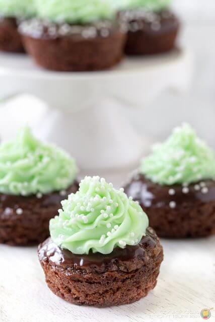 Shamrock Minty Brownie Bites with green frosting close up. St. Patrick's Day Menu Plan