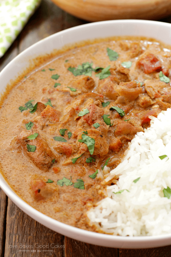 Slow Cooker Chicken Tikka Masala on a white plate with rice close up.
