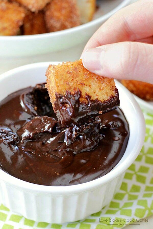 Churros Bites with Chocolate Dipping Sauce in a white bowl close up.