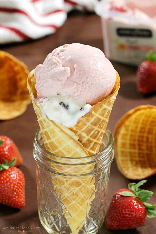 Homemade Waffle Cones in a jar with fresh strawberries.