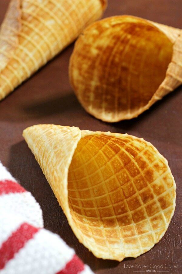 Homemade Waffle Cone shells laying on a cutting board.