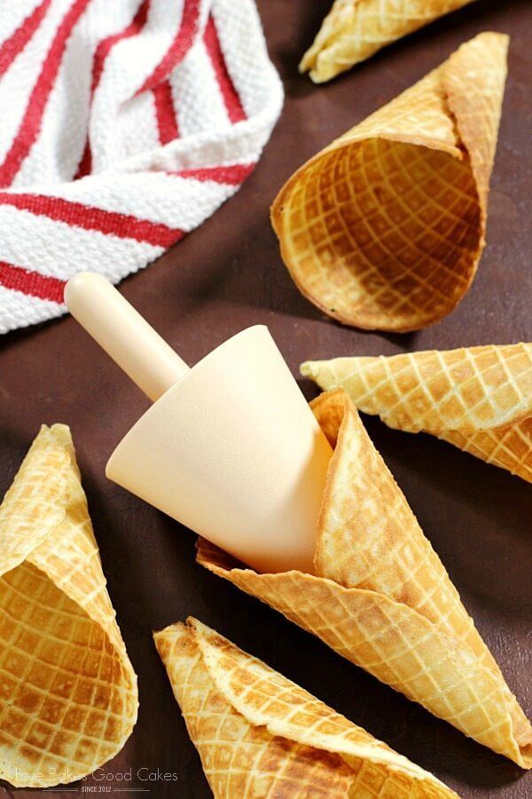 Homemade Waffle Cone shells laying on a cutting board.