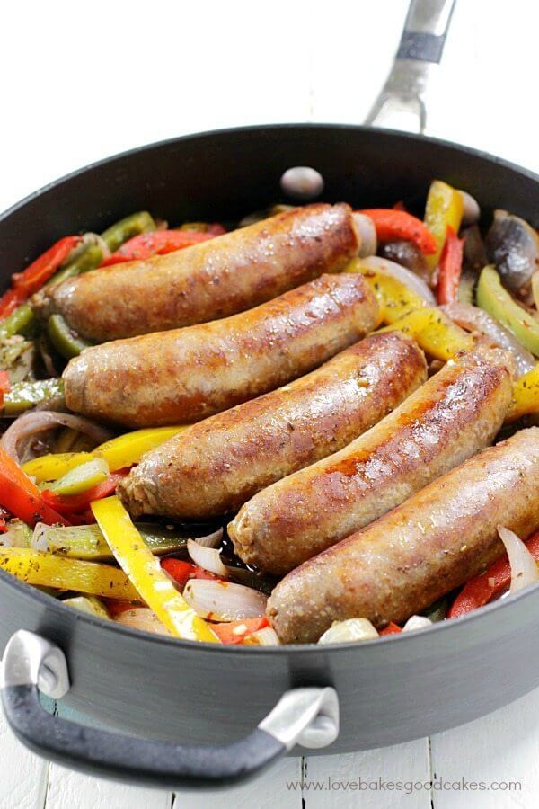 Rustic Italian Sausage with Peppers and Onions in a skillet.