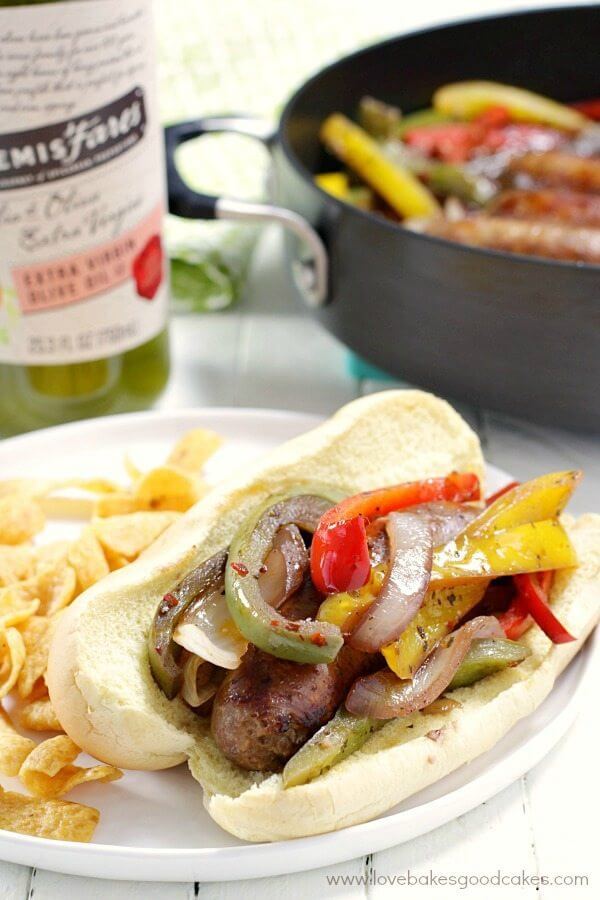 Rustic Italian Sausage with Peppers and Onions on a plate and in a skillet.
