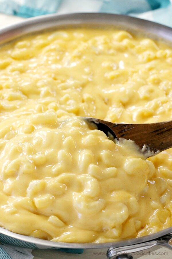 Creamy Stove top Mac & Cheese in a skillet close up with a spoon.