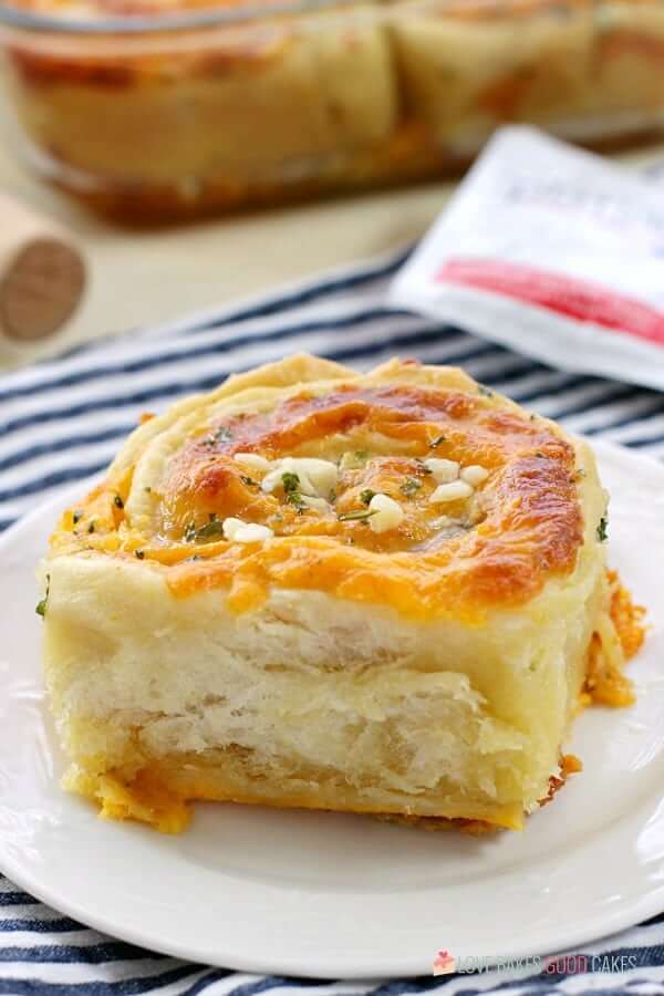 Cheesy Garlic Bread "Cinnamon" Roll in a casserole dish and on a plate close up.