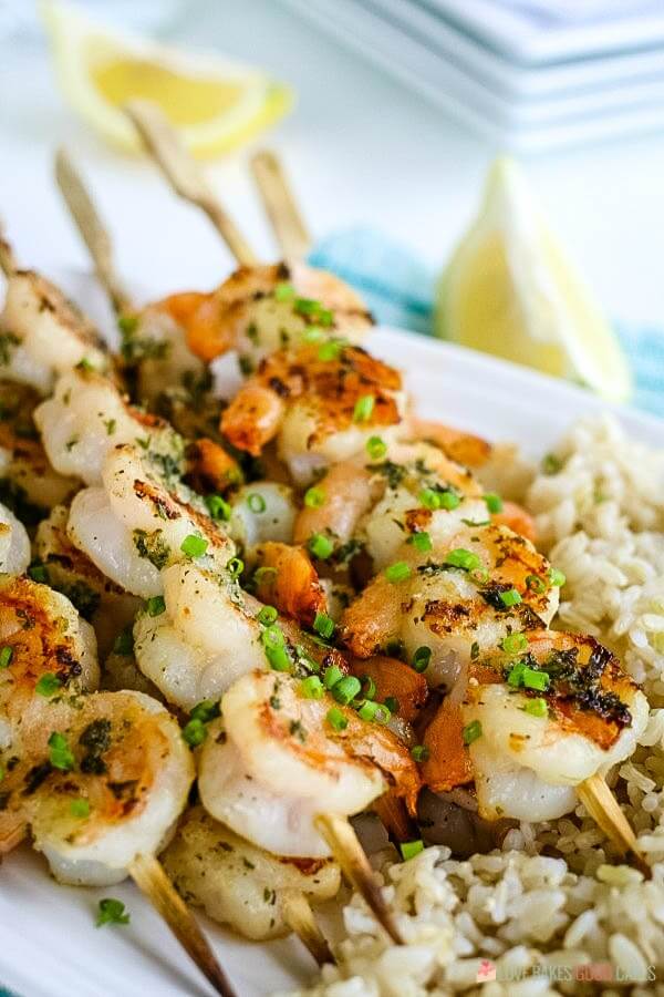 Closeup of grilled shrimp on skewers.