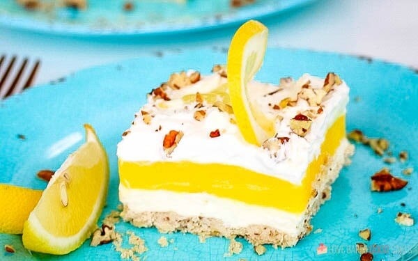 A piece of Lemon Lush Delight on plate.