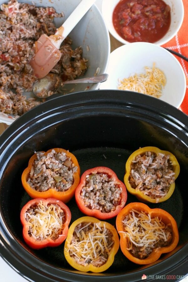 Ground beef stuffed peppers are easy to make in your slow cooker.