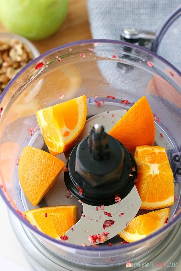 Next we put in the oranges because this cranberry relish recipe calls for oranges that are very finely chopped! 