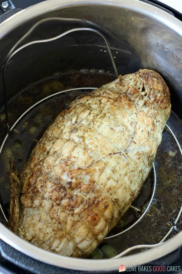 Image shows the Instant Pot turkey breast after being cooked and pressure released. 