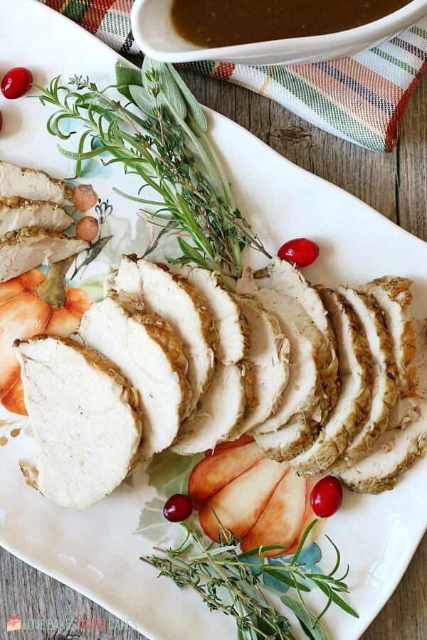 Pressure cooker turkey breast sliced and laid out on a platter ready to serve. 