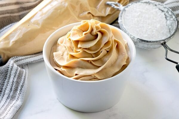 easy peanut butter frosting in small white bowl