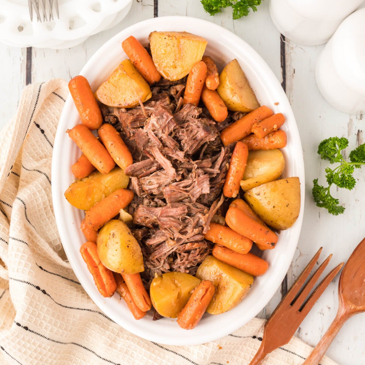 https://www.lovebakesgoodcakes.com/wp-content/uploads/2023/01/Old-Fashioned-Pot-Roast-Potatoes-Carrots-square.jpg