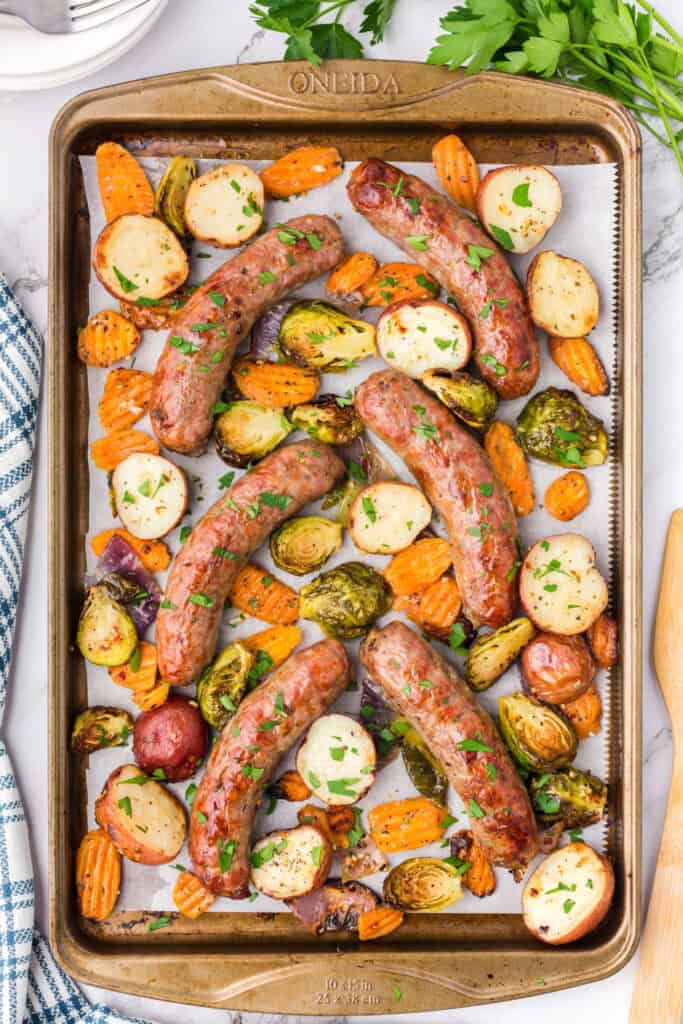 cooked sausage and veggies on baking sheet