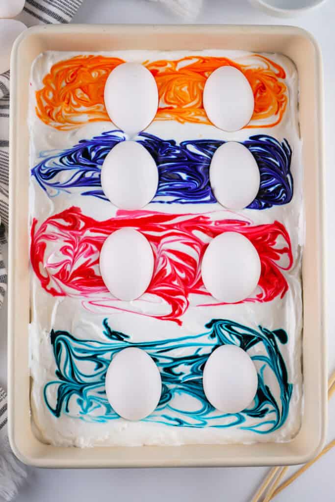 eggs placed on the food dye swirls