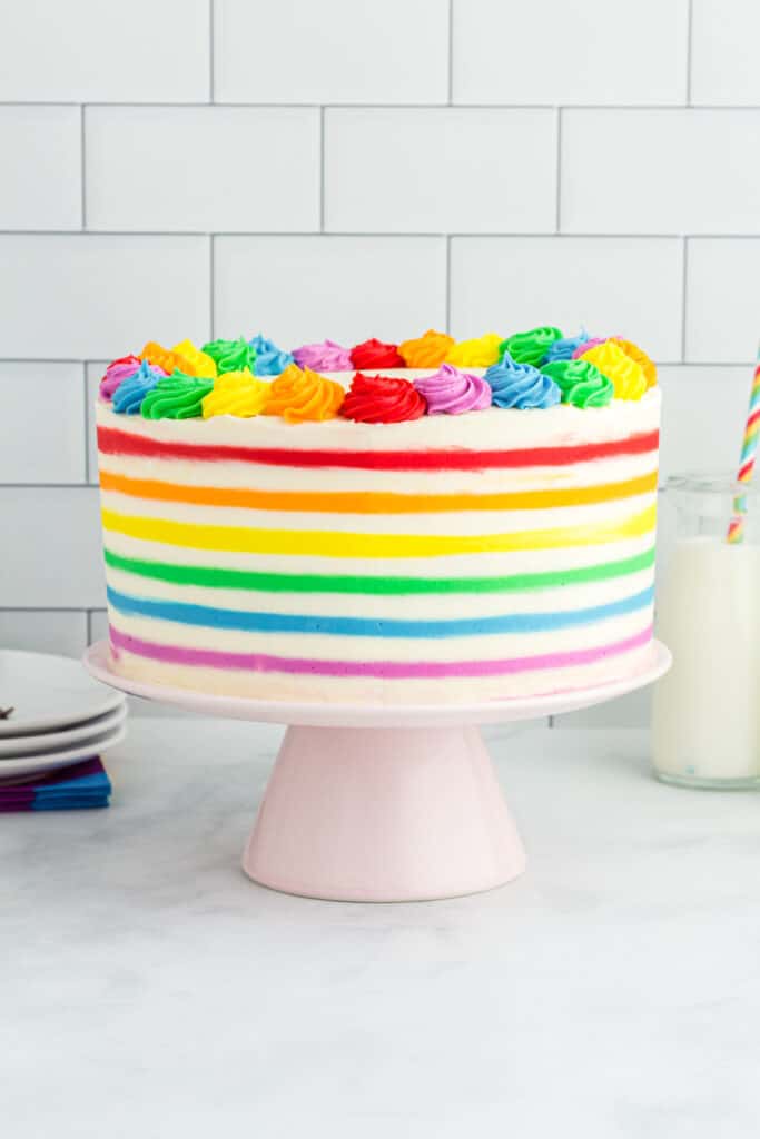 rainbow striped funfetti cake on cake stand