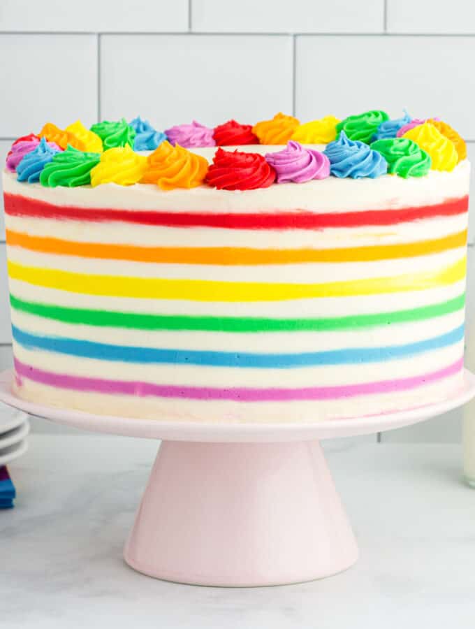 rainbow striped funfetti cake on cake stand